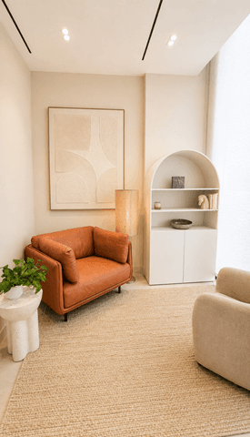 Bloomfield clinic therapy room with armchair and arched shelving